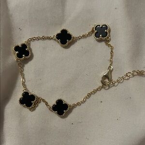 Gold Four-Leaf Clover Chain Bracelet with Black Accents
